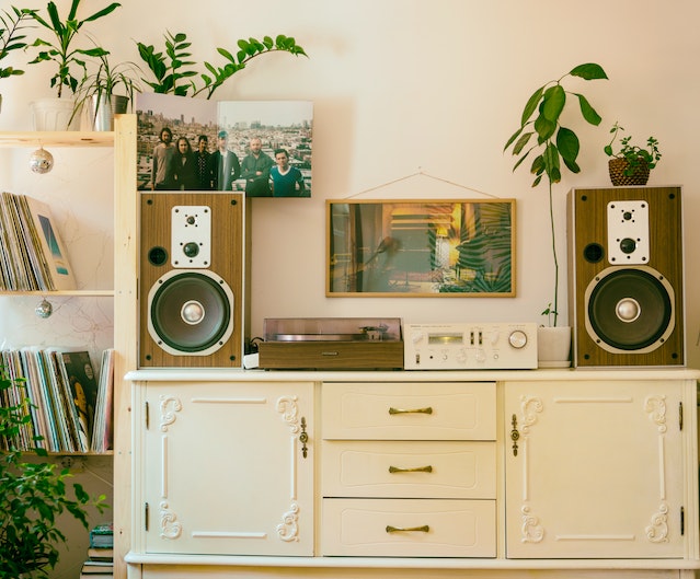 A gramophone on a white vintage dresser