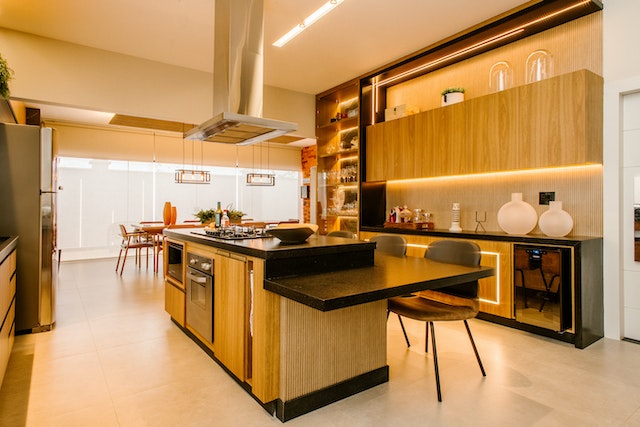 A black and wooden interior design of a modern kitchen