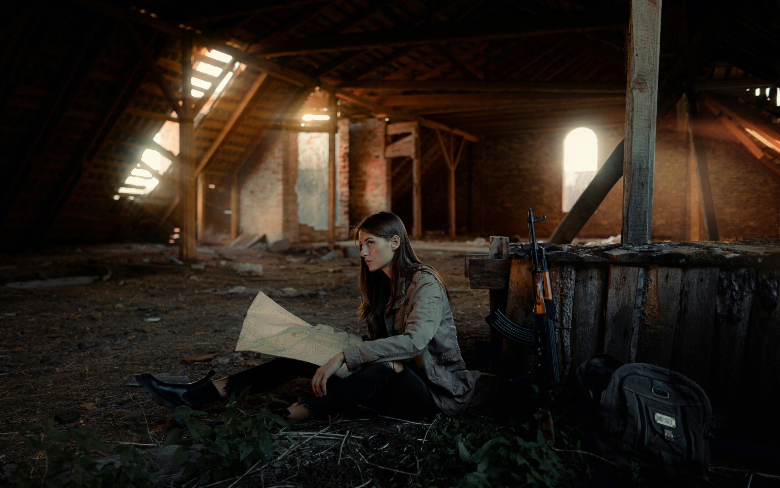 A woman sitting in an attic considering how to transform unused space into a stylish storage area.